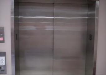 behind door #1 is gold, or a llama? closed elevator door at Sitterson